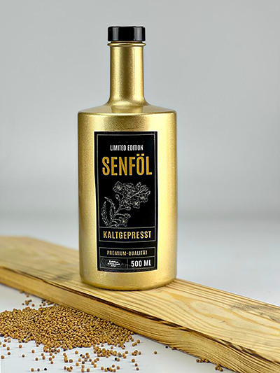 Senfol-Goldene-Flasche-mit-Senfkornern